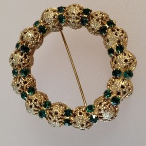 Vintage goldtone brooch mesh circle design prong set green rhinestones glamour